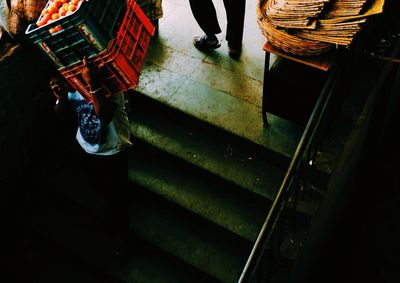 Low section of people walking on floor