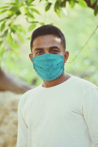 Portrait of young man standing outdoors