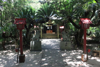 Gazebo by street in park against buildings