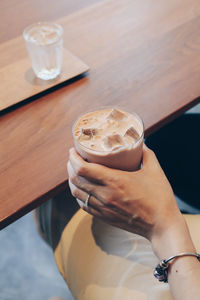 High angle view of coffee cup on table