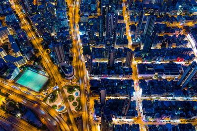 Aerial view of illuminated city buildings at night