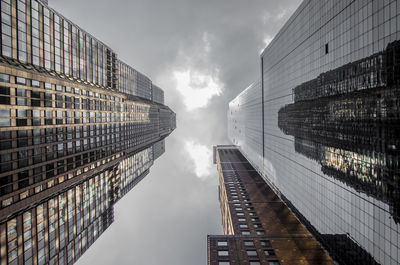 Directly below shot of modern buildings against sky