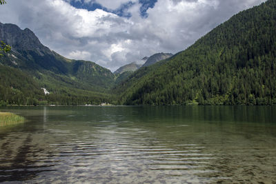 Scenic view of lake and mountains against sky