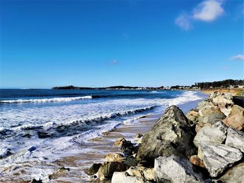 Scenic view of sea against blue sky
