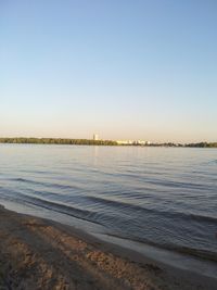 Scenic view of beach against clear sky