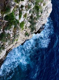 High angle view of rock formation in sea