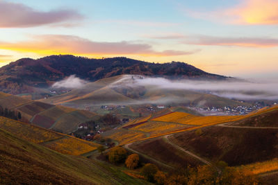 Scenic view of landscape against sky during sunset