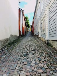 Cobblestone street against sky