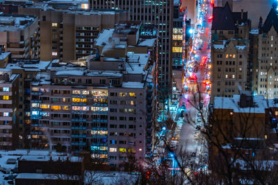 Illuminated buildings in city at night