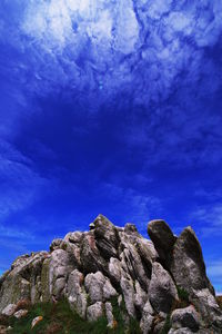 Low angle view of rock formation against sky