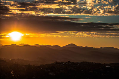 Scenic view of mountains at sunset