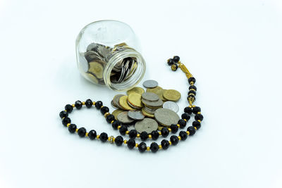 High angle view of coins on white background