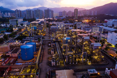 High angle view of illuminated buildings in city at night