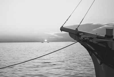 Fishing boat in sea against sky