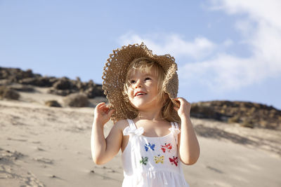 Spain, fuerteventura, happy girl on the beach