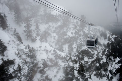 Low angle view of ski lift against sky