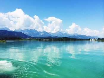 Scenic view of lake against cloudy sky