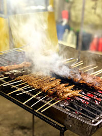 Close-up of meat on barbecue grill