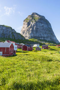 Village on the island sanna and the mountain traenstaven in norway