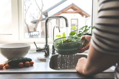Midsection of person preparing food at home