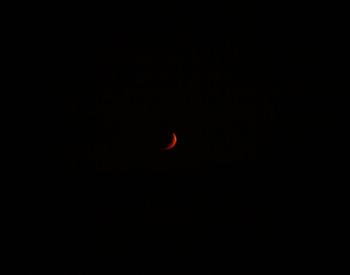 Low angle view of moon against sky at night