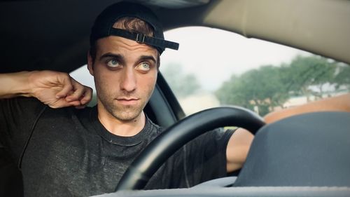 Portrait of young man wearing hat