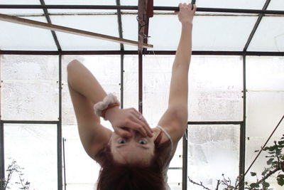 Portrait of boy in glass window