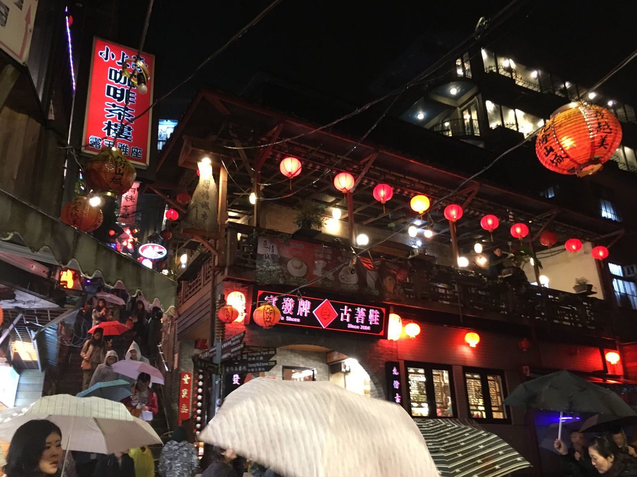 illuminated, night, lighting equipment, text, indoors, transportation, communication, low angle view, incidental people, non-western script, western script, built structure, architecture, travel, lantern, technology, city, hanging, neon