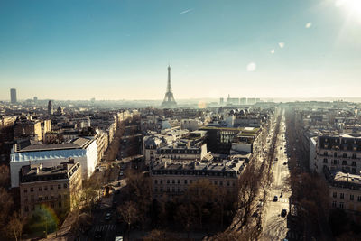 Aerial view of cityscape against clear sky during sunny day