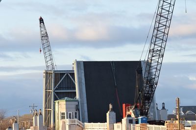 Low angle view of crane at construction site