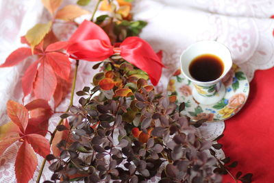 Close-up of cup and coffee on table