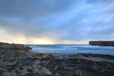 Scenic view of beach and sea against sky