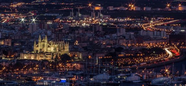 High angle view of illuminated cityscape at night