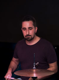 Man playing drum during concert