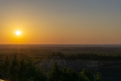 Scenic view of landscape against sky during sunset