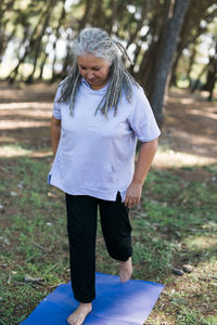 Young woman standing on field