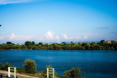 Scenic view of lake against blue sky