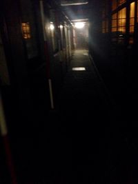 Illuminated walkway at night