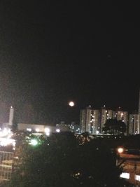 Illuminated cityscape at night