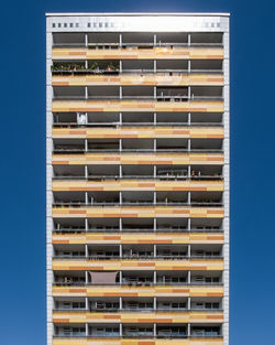 Close-up of building against blue sky