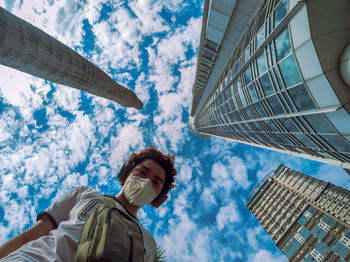 Low angle view of building against cloudy sky