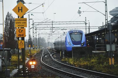 Train on railroad tracks against sky