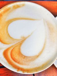 Close-up of cappuccino on table