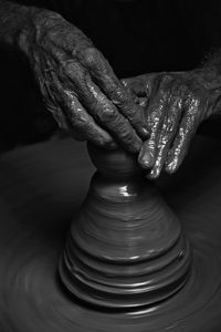 Cropped hands of man working at workshop