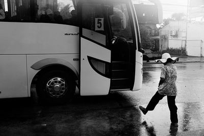 Man walking towards in bus