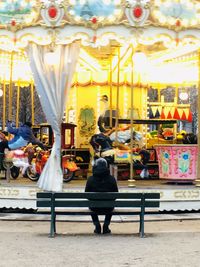 Rear view of people at amusement park