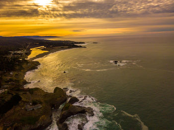 Scenic view of sea against cloudy sky