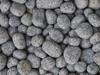 High angle view of pebble stones on field