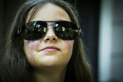 Close-up portrait of girl wearing sunglasses