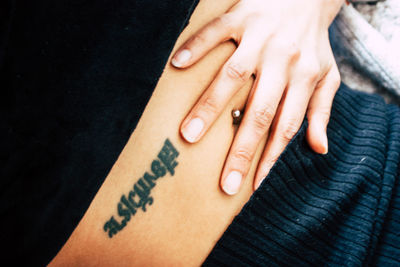 Close-up of woman hand with tattoo